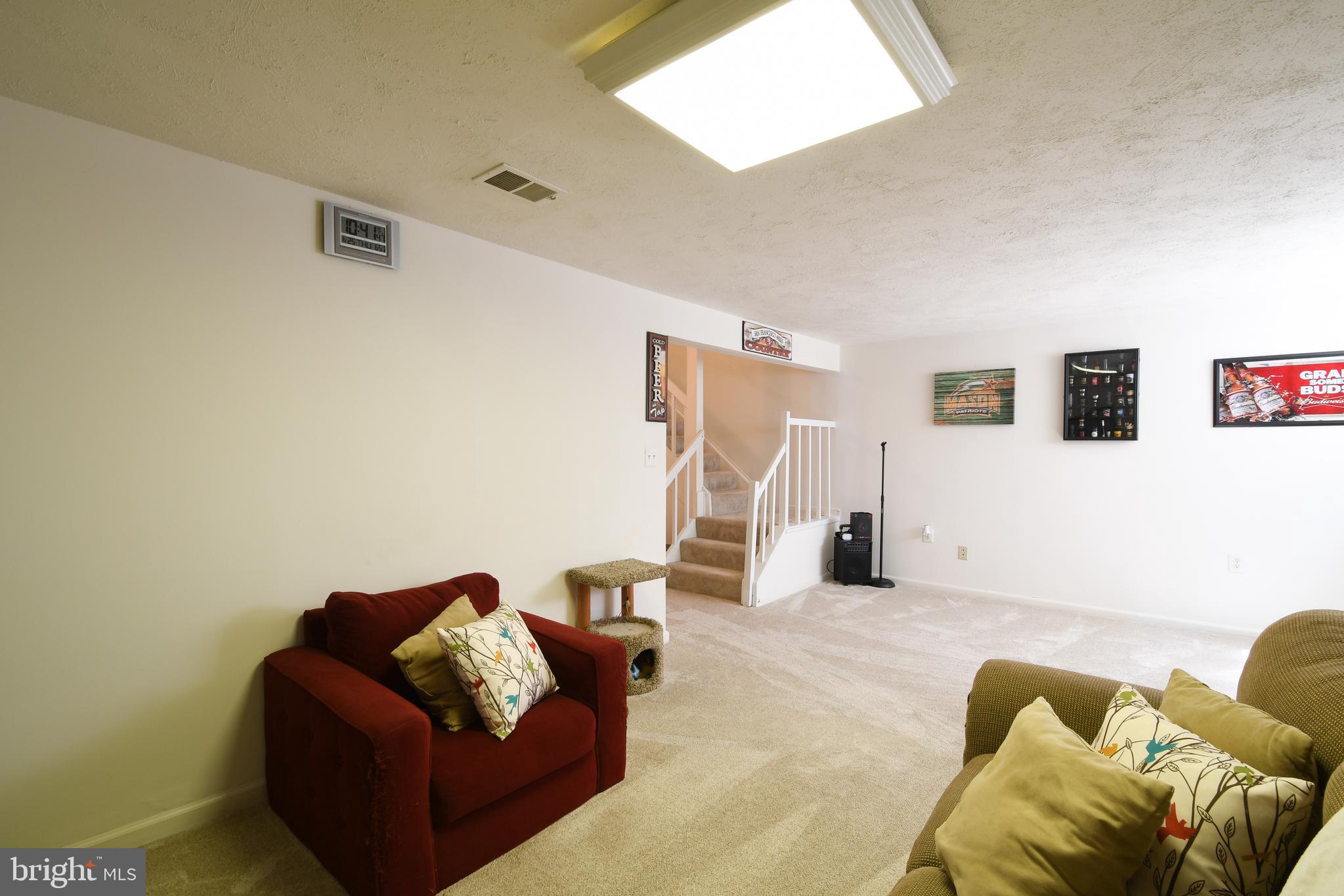 8523 Jenner Court Springfield, VA 22153 - Photo 32 of 41 Two couches and still room for game tables