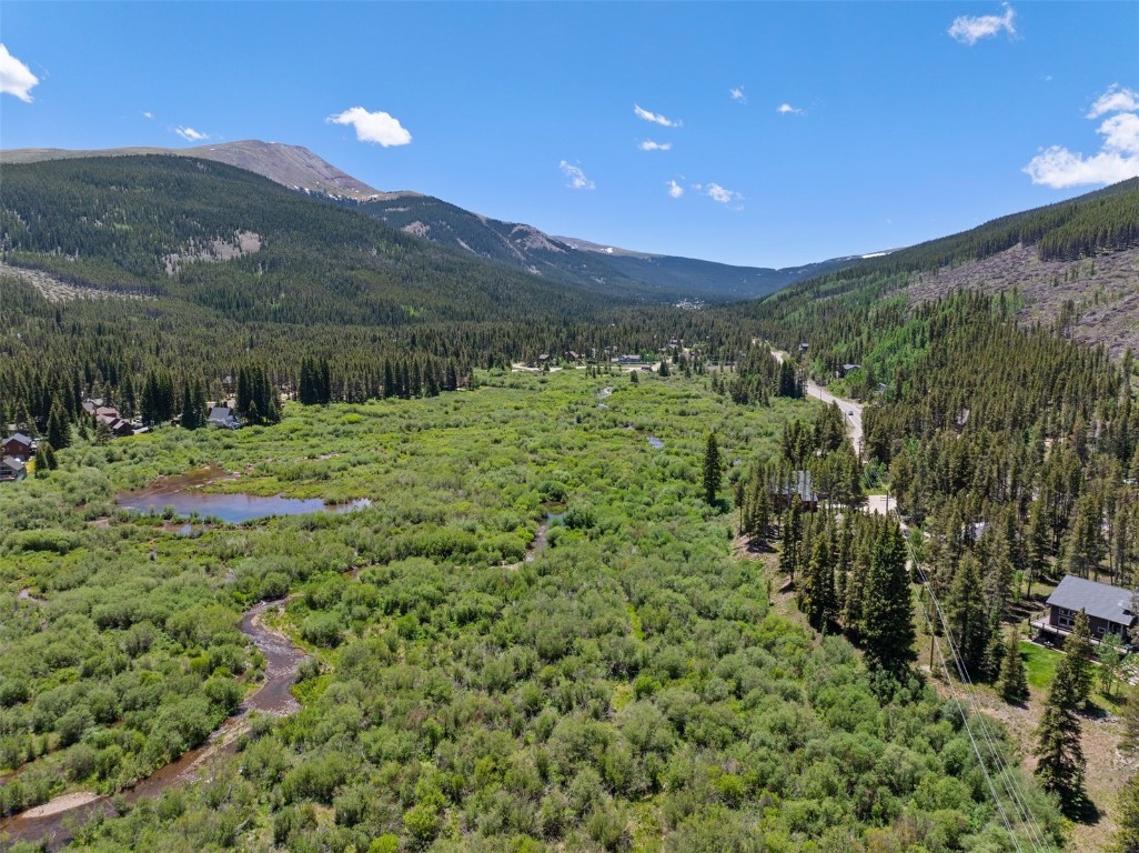 16 Rustic Terrace Breckenridge, CO 80424 - Photo 12 of 15 a view of a big yard with green space and mountain view in back