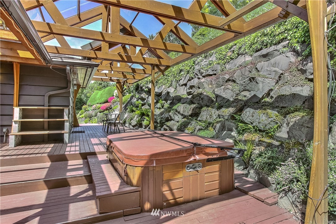 4032 Southwest Myrtle Street Seattle, WA 98136 - Photo 11 of 23 a view of a backyard with a table and chairs