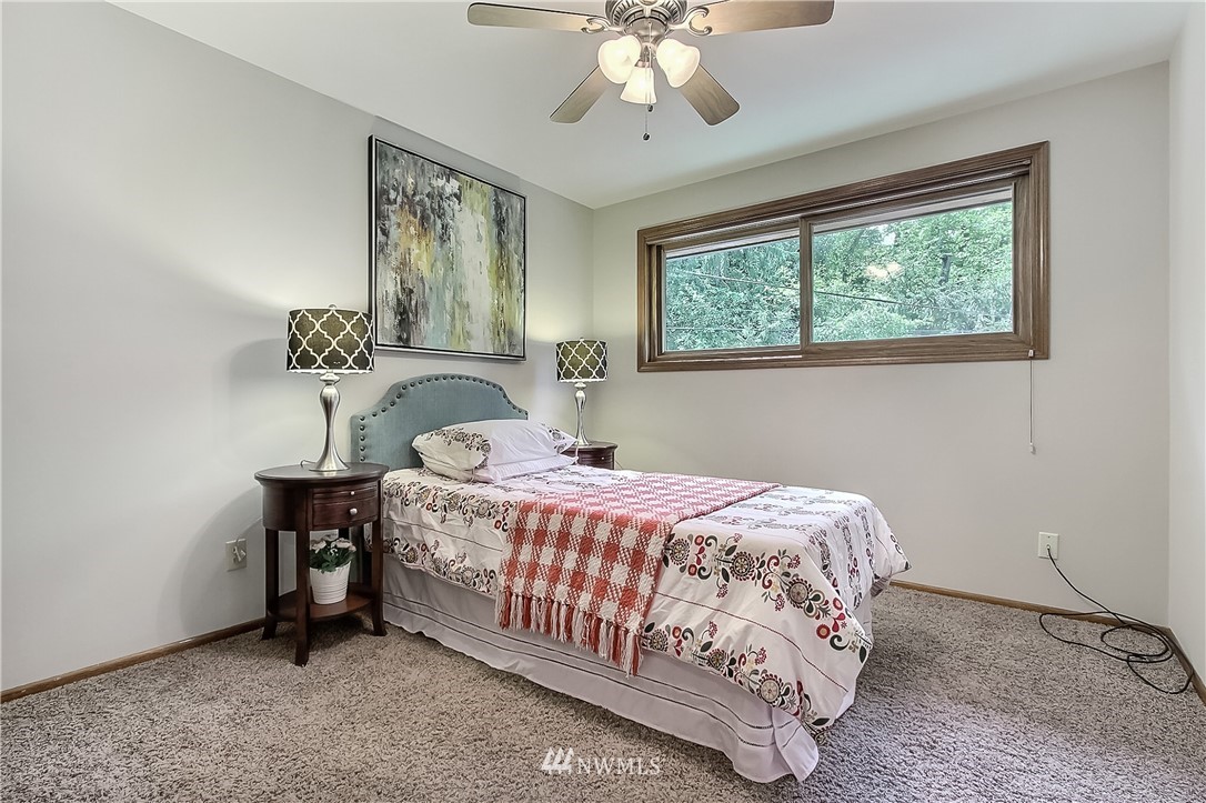 4032 Southwest Myrtle Street Seattle, WA 98136 - Photo 16 of 23 a bedroom with a bed and a window