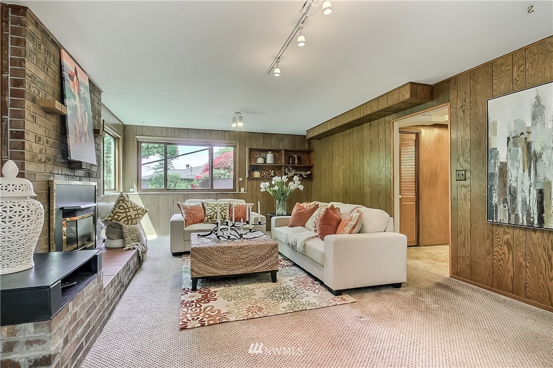 4032 Southwest Myrtle Street Seattle, WA 98136 - Photo 17 of 23 a living room with furniture and a fireplace