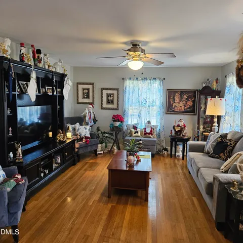 a living room with furniture and a flat screen tv