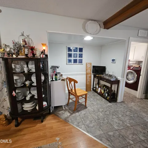 a view of a room with workspace and a window