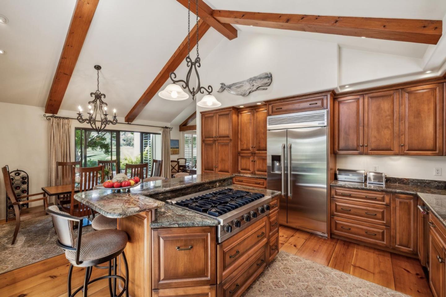 9546 Maple Court Carmel, CA 93923 - Photo 15 of 36 a kitchen with a stove a sink and cabinets
