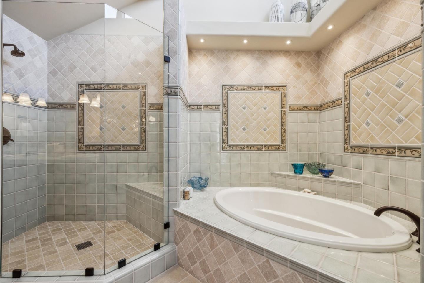 9546 Maple Court Carmel, CA 93923 - Photo 23 of 36 a bathroom with a tub a sink and mirror