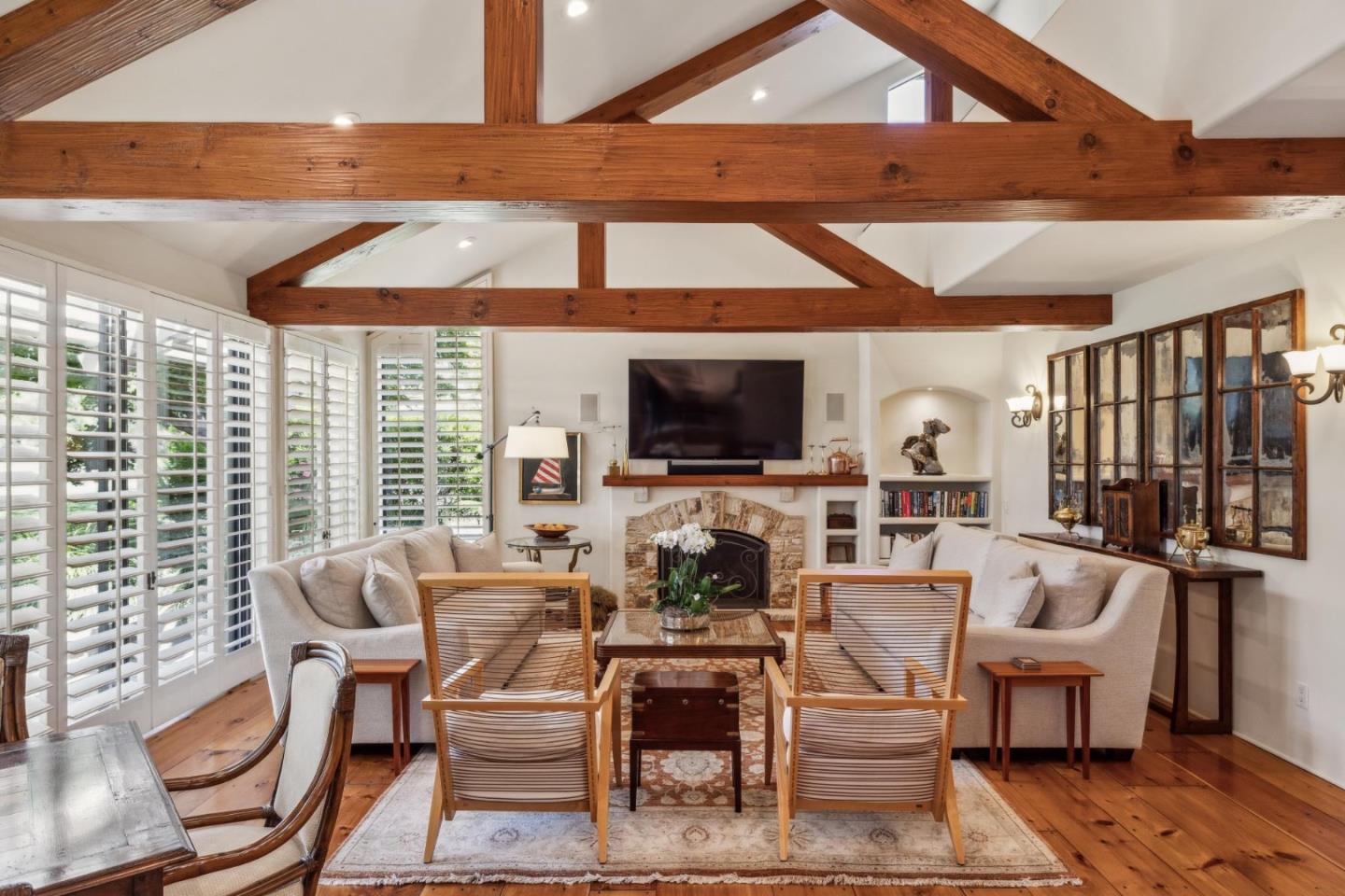 9546 Maple Court Carmel, CA 93923 - Photo 3 of 36 a living room with fireplace furniture and a flat screen tv
