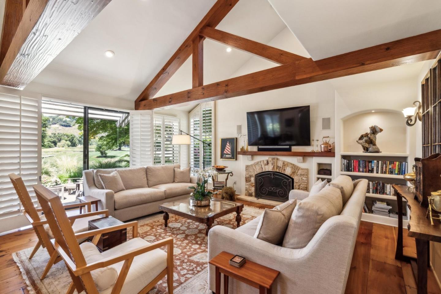 9546 Maple Court Carmel, CA 93923 - Photo 5 of 36 a living room with furniture a fireplace and a flat screen tv