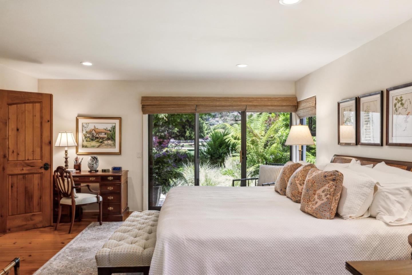 9546 Maple Court Carmel, CA 93923 - Photo 10 of 36 a bedroom with a bed and large windows