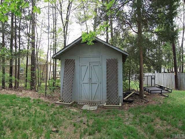 5312 McCormick Road Durham, NC 27713 - Photo 11 of 12 Storage Shed in back yard gives you room for all your items