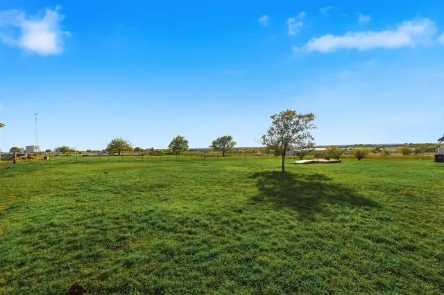 a view of a golf course with a lake