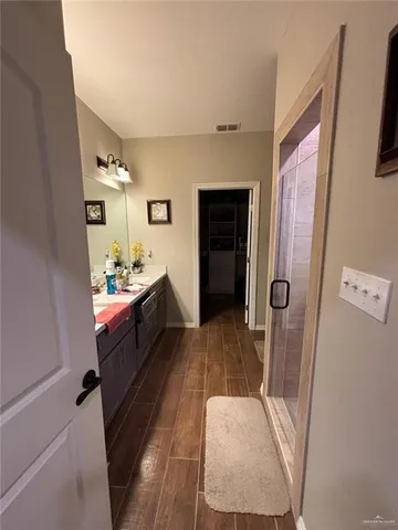 a room with wooden floor and furniture