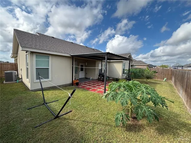 a house view with a backyard space
