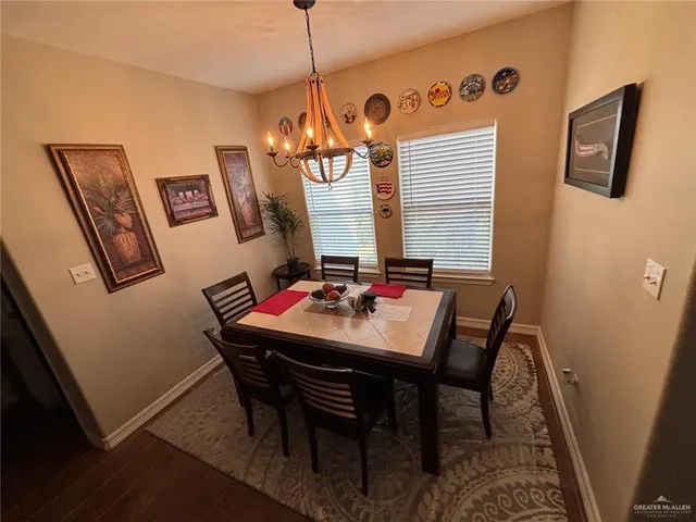 a room with a table and chairs