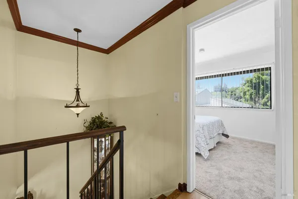 a view of a hallway with a window