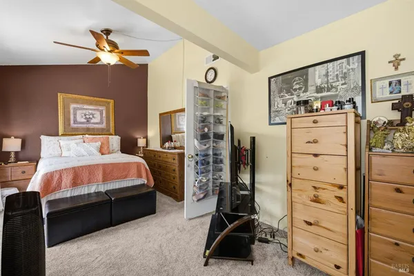 a bedroom with a bed and a walk in closet