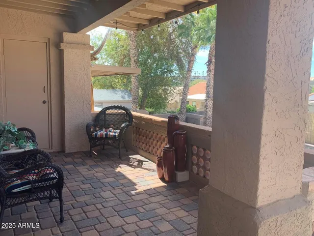 a view of a porch with furniture and yard