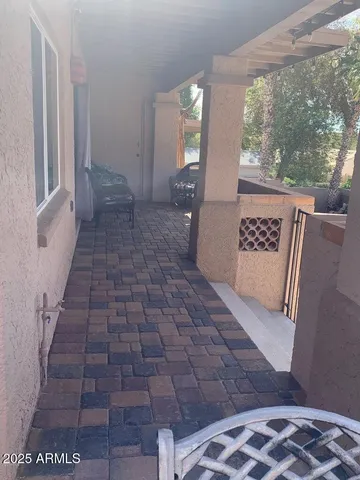 a room with furniture and potted plants