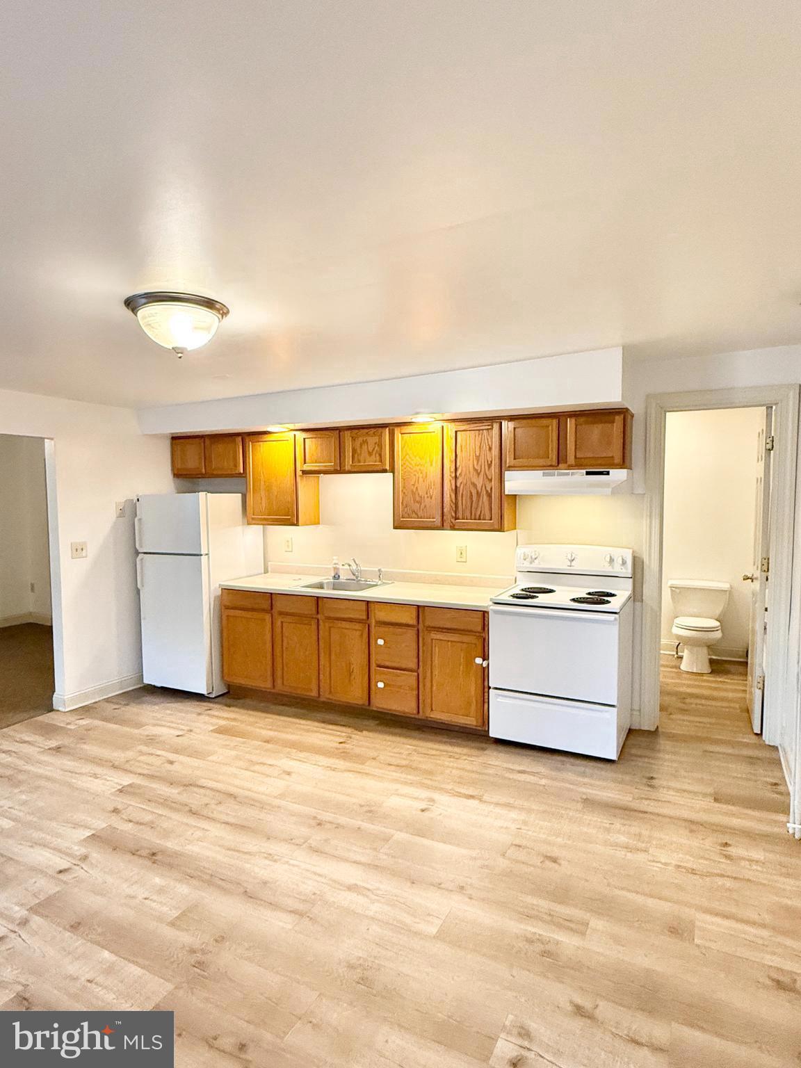 26 North Main Street Spring City, PA 19475 - Photo 2 of 12 a large white bed in a white room