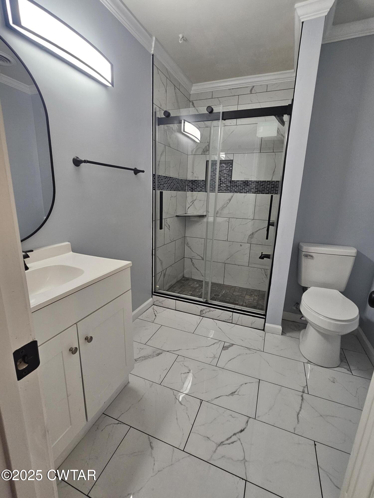 116 Chickering Road Jackson, TN 38305 - Photo 13 of 20 a bathroom with a sink toilet and shower