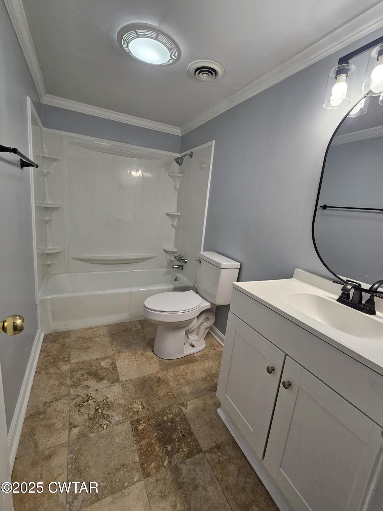 116 Chickering Road Jackson, TN 38305 - Photo 14 of 20 a bathroom with a granite countertop sink toilet a mirror and shower