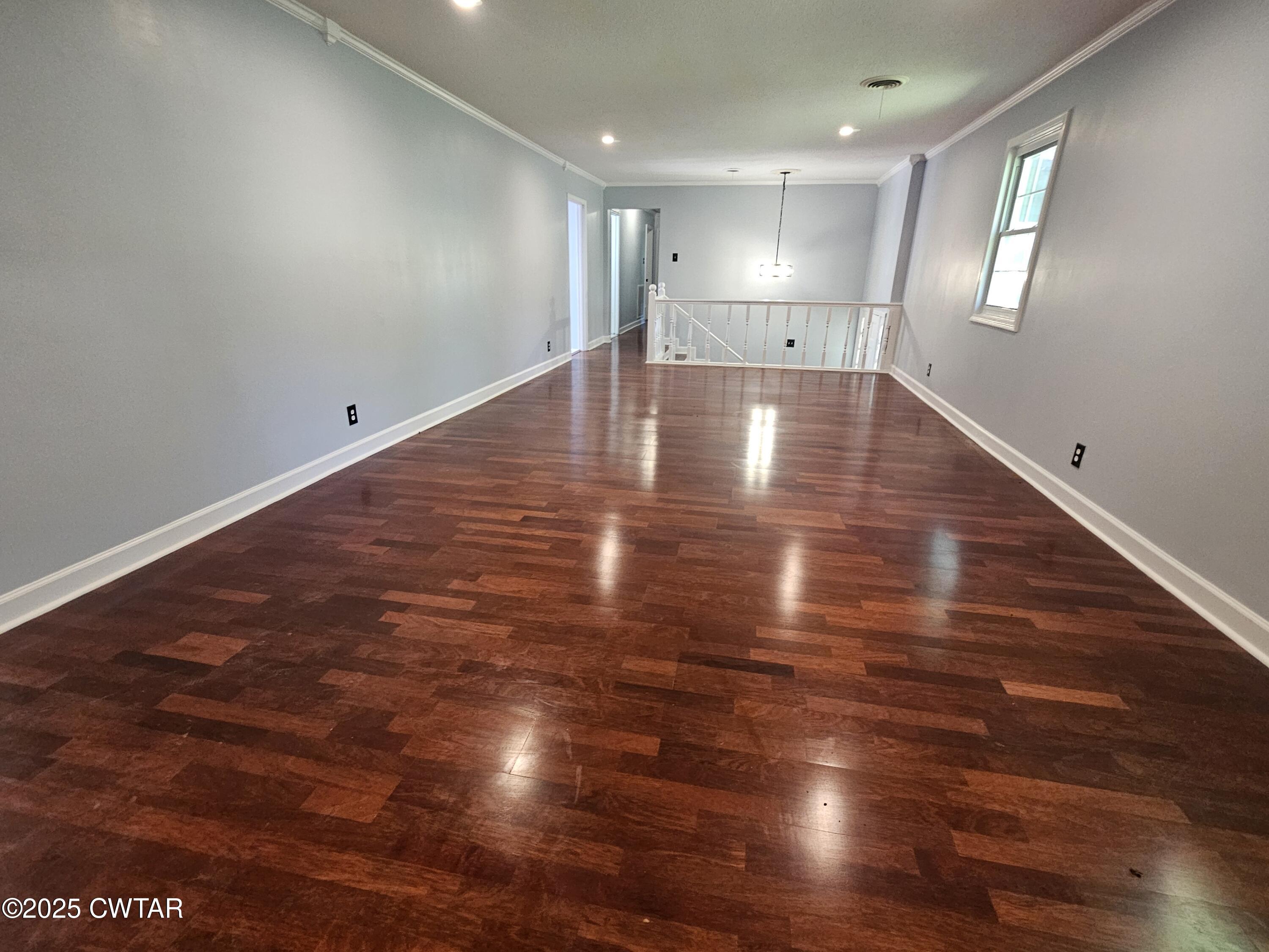 116 Chickering Road Jackson, TN 38305 - Photo 16 of 20 a view of an empty room with wooden floor