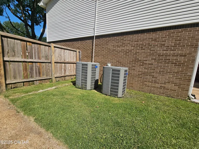 a view of a backyard of the house