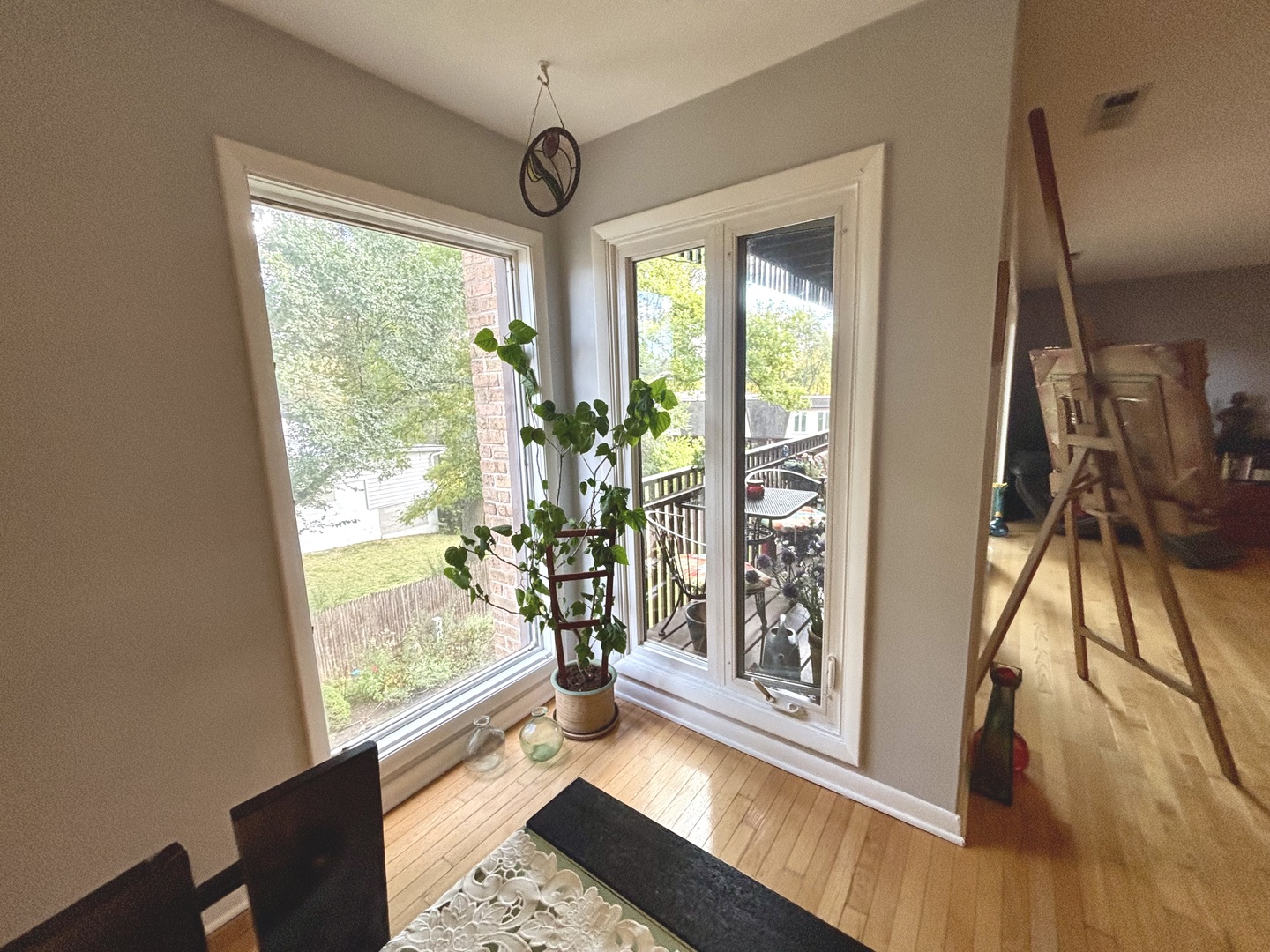 1847 Tanglewood Drive, Unit 3B Glenview, IL 60025 - Photo 15 of 30 a view of hallway with a large window and wooden floor