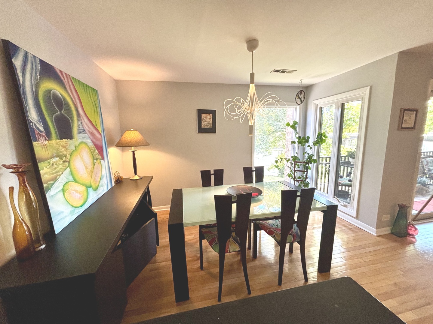 1847 Tanglewood Drive, Unit 3B Glenview, IL 60025 - Photo 8 of 30 a view of a dining room with furniture and wooden floor