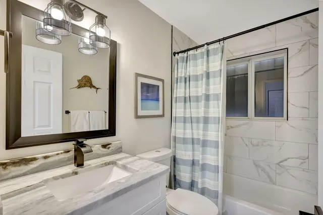 a view of a chairs and table in the balcony