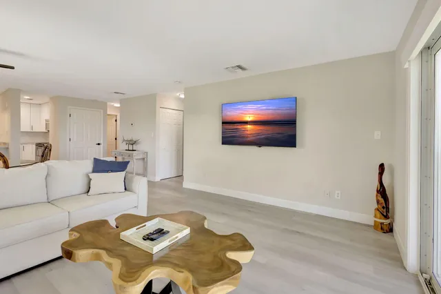 a bedroom with a large bed and a large window