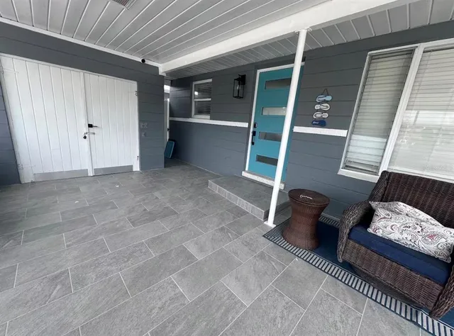 a view of room with furniture and windows