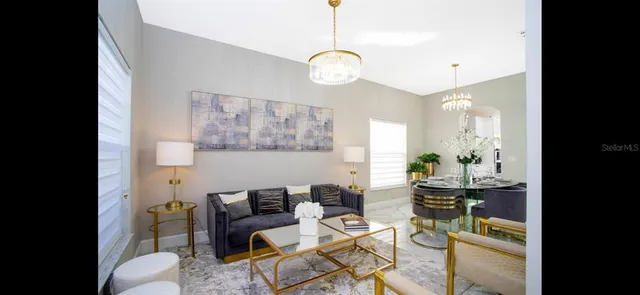 a dining room with furniture and window