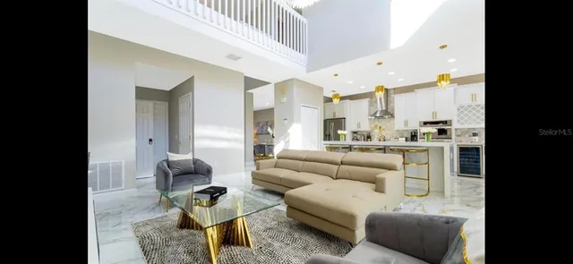 a kitchen with stainless steel appliances granite countertop a stove and a microwave