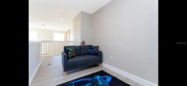 a dining room with furniture and wooden floor