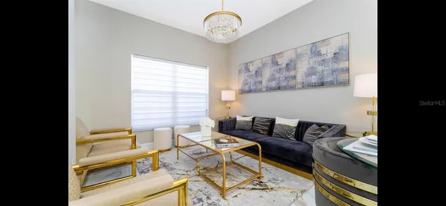 a living room with furniture and a window