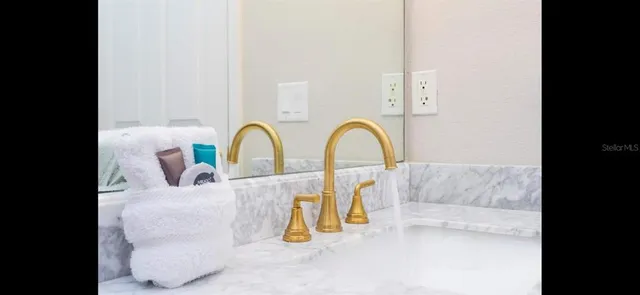 a view of a swimming pool with a faucet