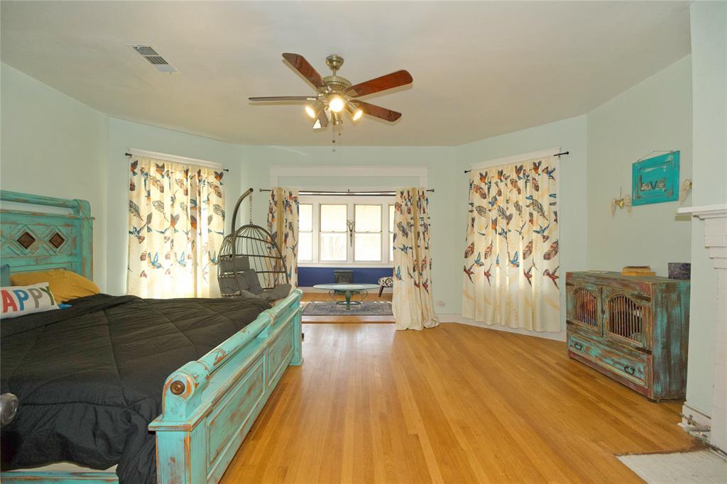 213 South Clements Street Gainesville, TX 76240 - Photo 19 of 37 a view of a livingroom with furniture wooden floor and windows