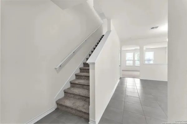 a view of an entryway with wooden floor
