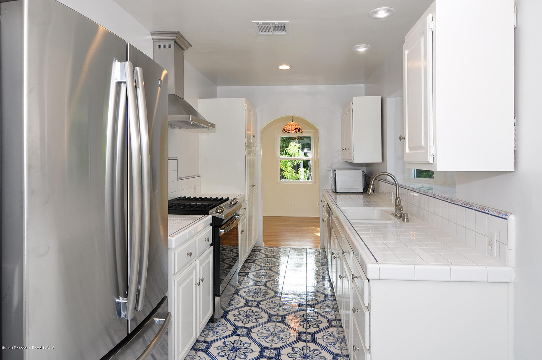 2011 Minoru Drive Altadena, CA 91001 - Photo 11 of 33 a kitchen with a sink a stove and refrigerator
