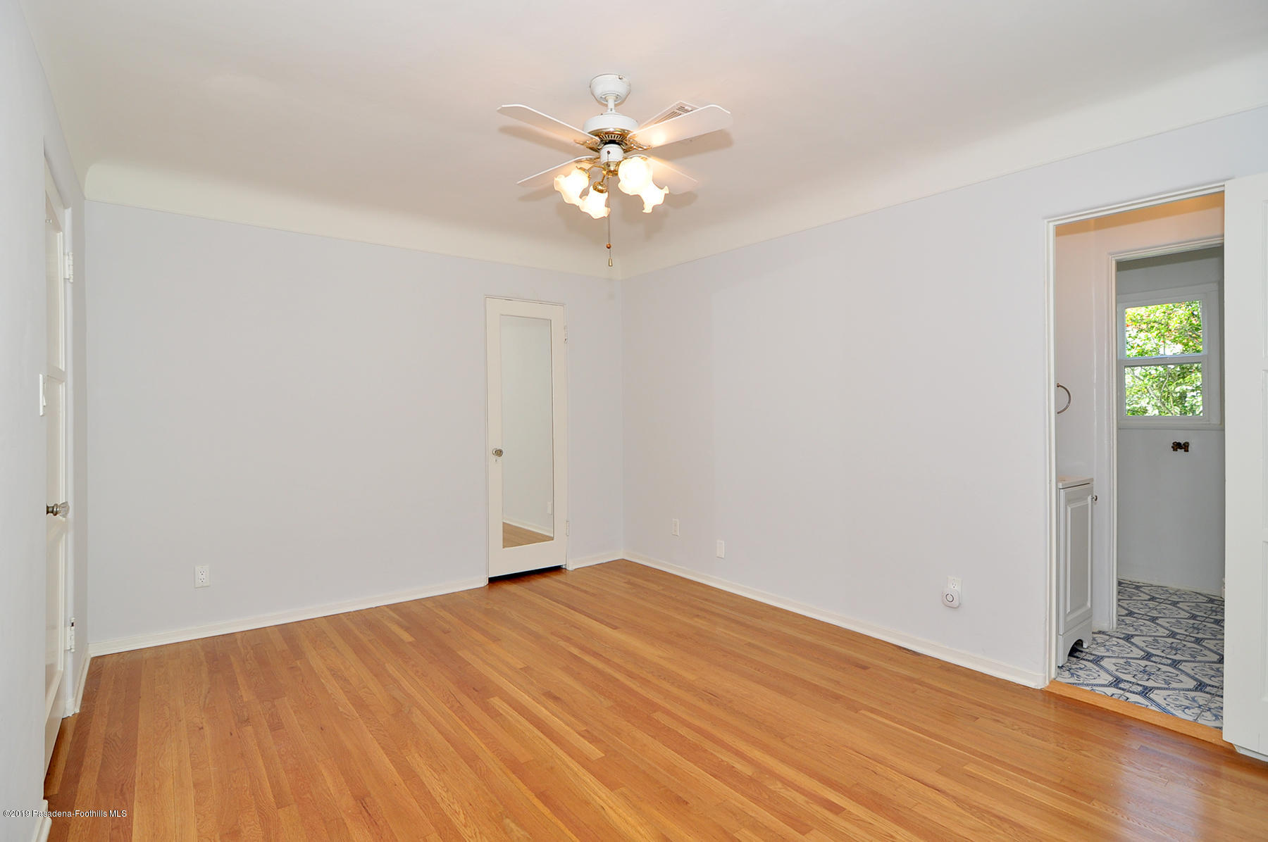 2011 Minoru Drive Altadena, CA 91001 - Photo 16 of 33 a view of a room with a chandelier fan and wooden floor