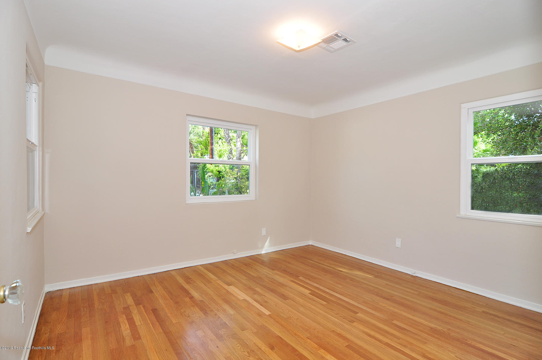 2011 Minoru Drive Altadena, CA 91001 - Photo 17 of 33 wooden floor in an empty room with a window