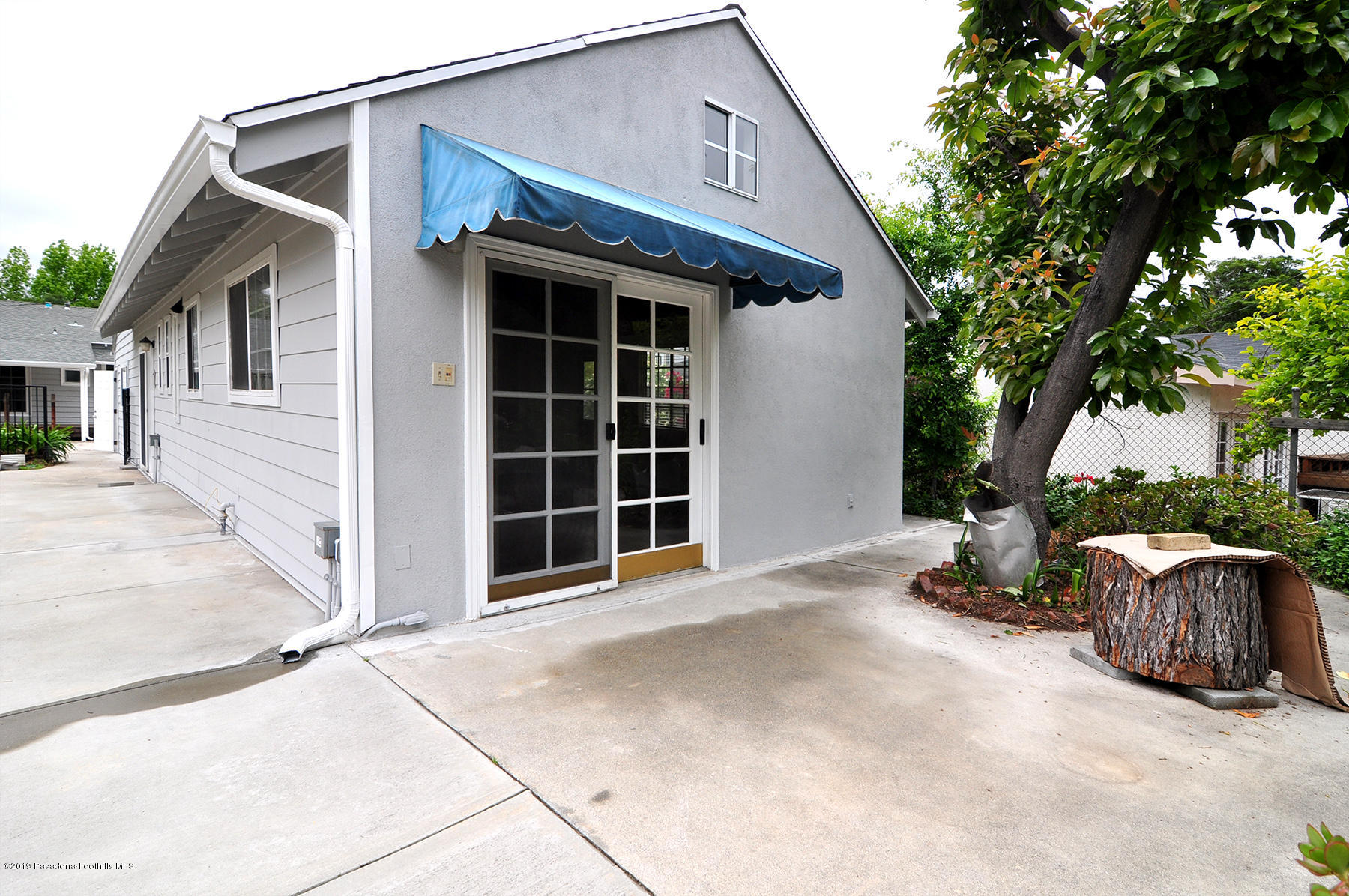 2011 Minoru Drive Altadena, CA 91001 - Photo 31 of 33 a view of a house with a large tree and wooden fence
