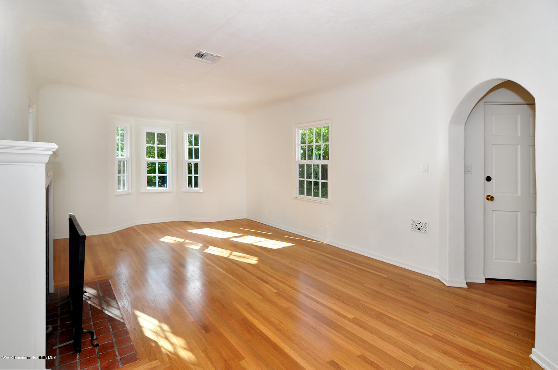 2011 Minoru Drive Altadena, CA 91001 - Photo 6 of 33 a view of empty room with wooden floor and window