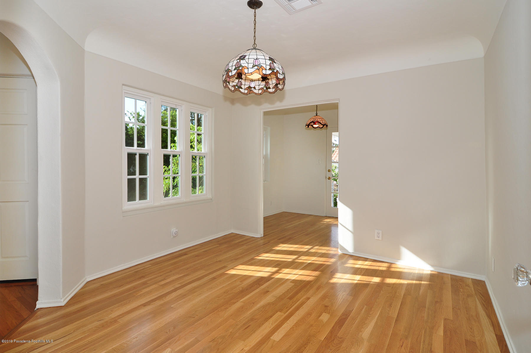 2011 Minoru Drive Altadena, CA 91001 - Photo 7 of 33 a view of an empty room with window and wooden floor