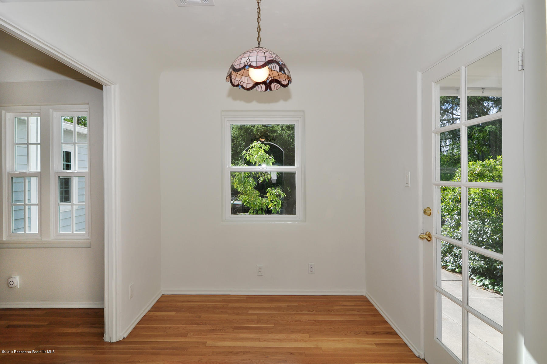 2011 Minoru Drive Altadena, CA 91001 - Photo 8 of 33 a view of an empty room with wooden floor and a window