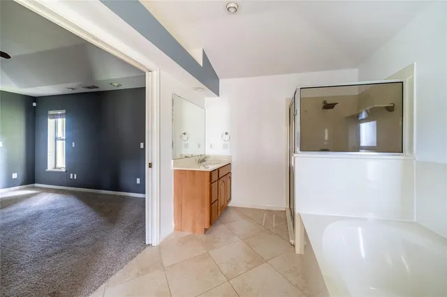 a view of a bathroom with sink and bathtub