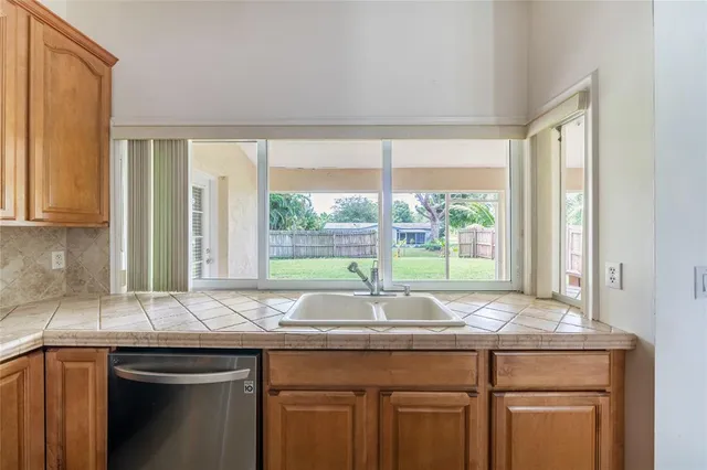 a sink sitting next to a window