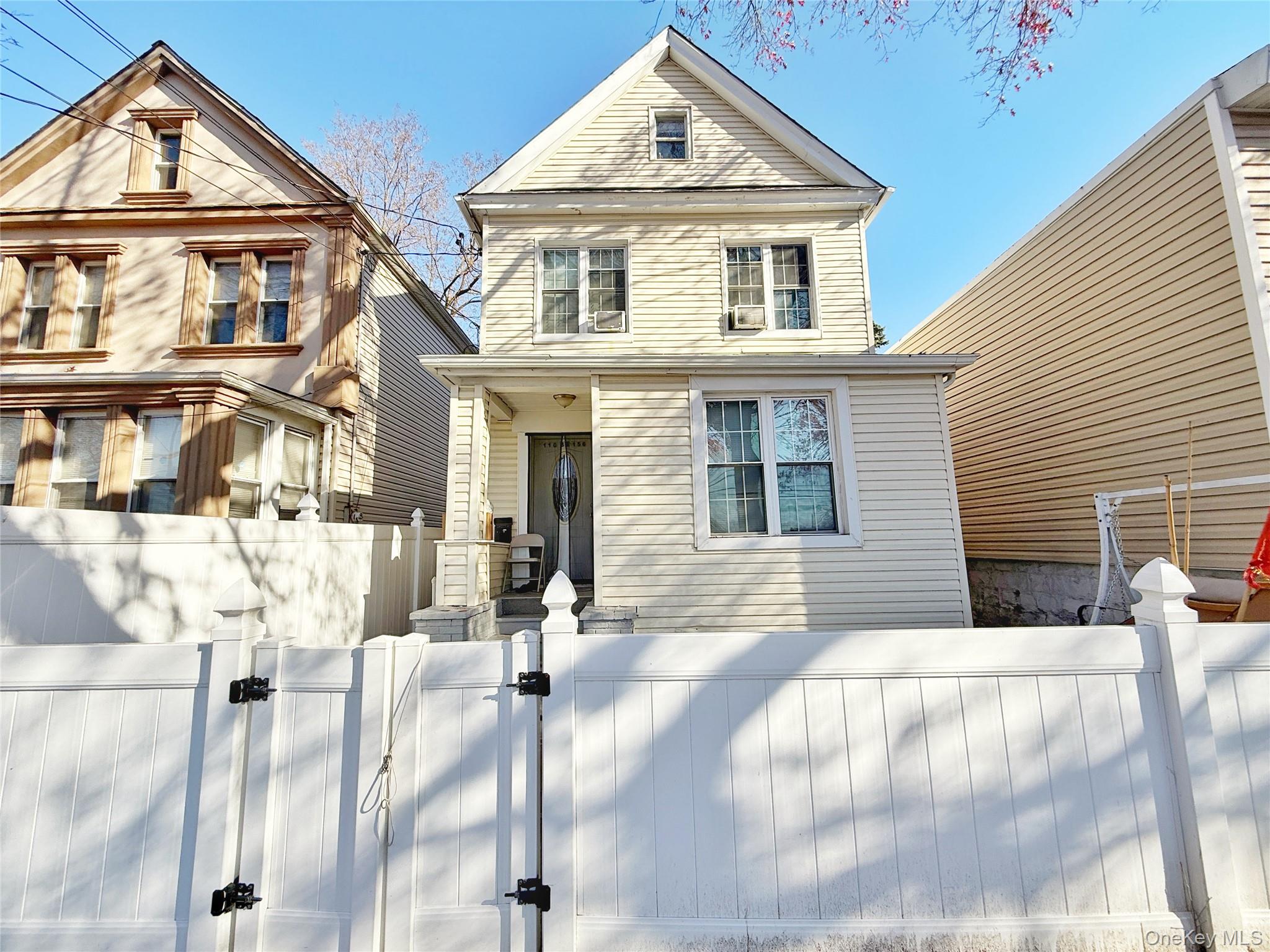 110-39 156th Street Queens, NY 11433 - Photo 2 of 27 a front view of house with a yard