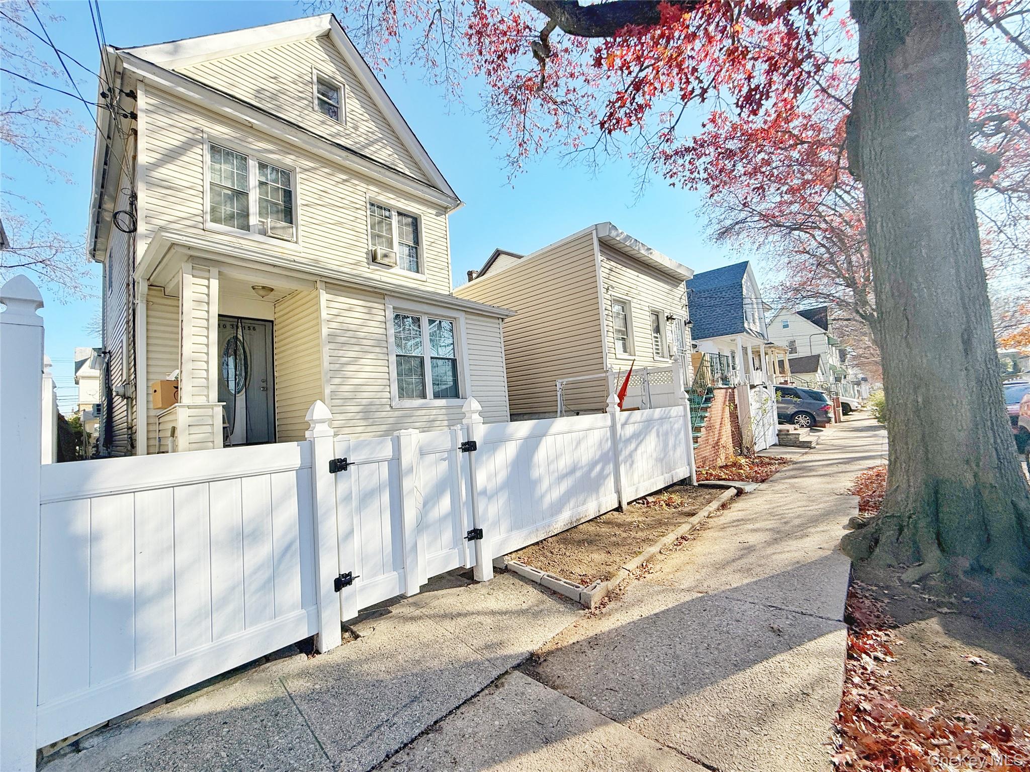 110-39 156th Street Queens, NY 11433 - Photo 27 of 27 a view of a brick house with a large windows