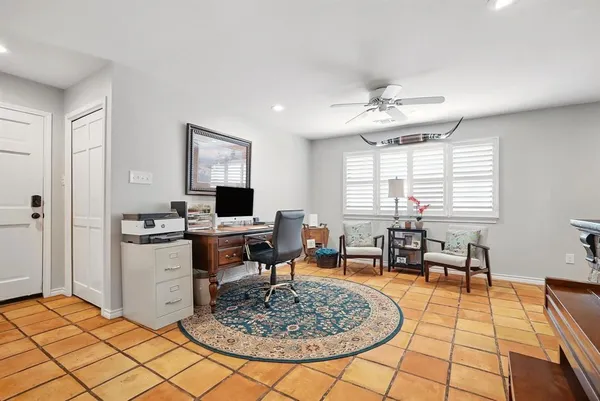 a living room with furniture a table and a window